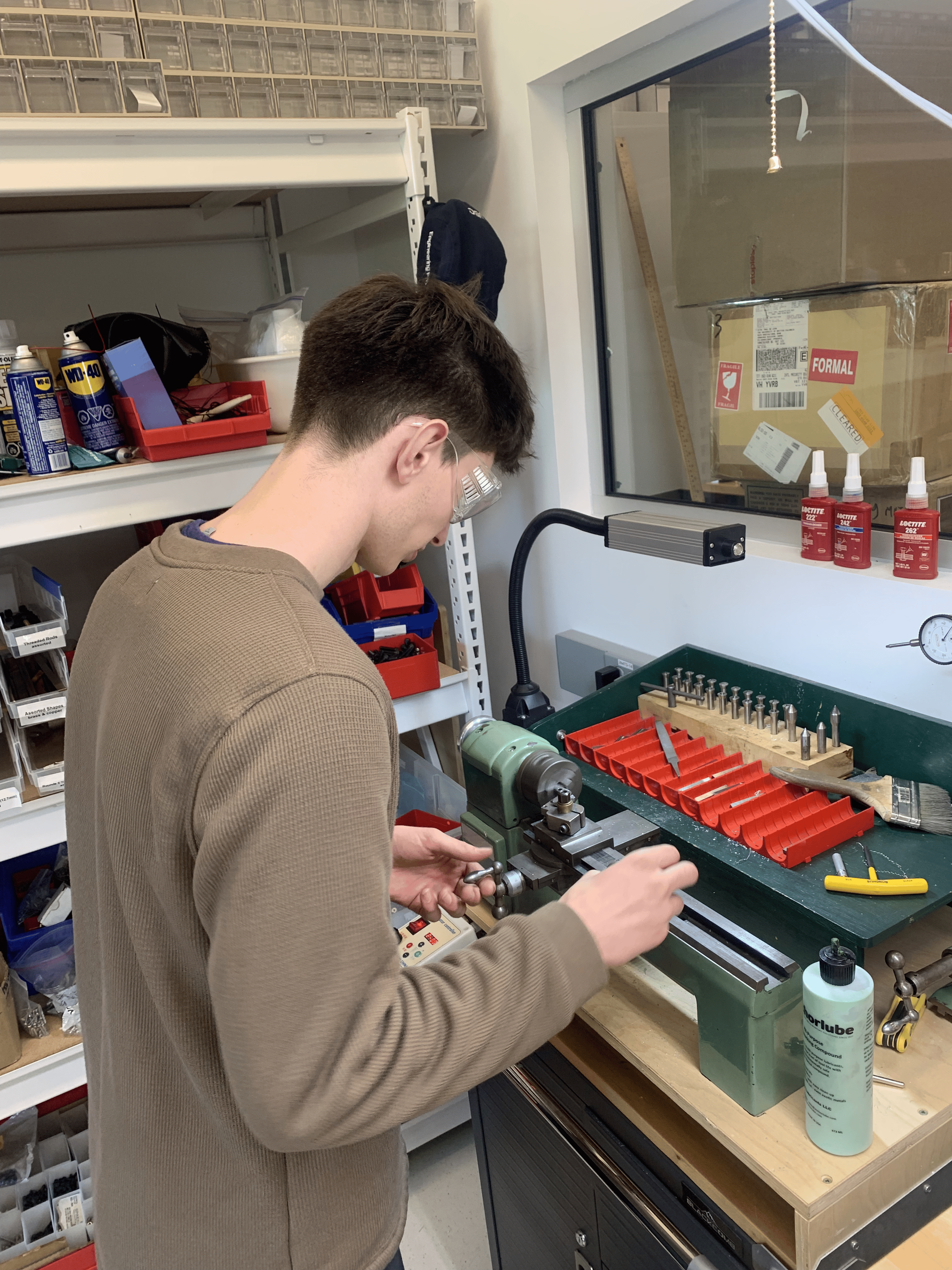 Luca using the lathe